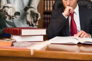 Illustration showing factors to consider when hiring a criminal defense attorney
