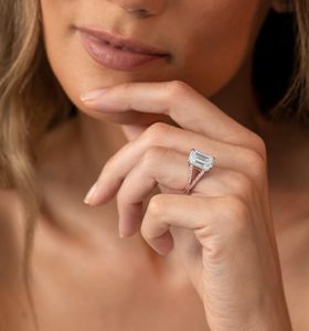 A moissanite engagement ring with a sparkling round-cut gemstone set in a sleek metal band