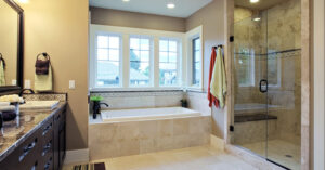 Contemporary bathroom with floating vanity, large mirror, and walk-in shower
